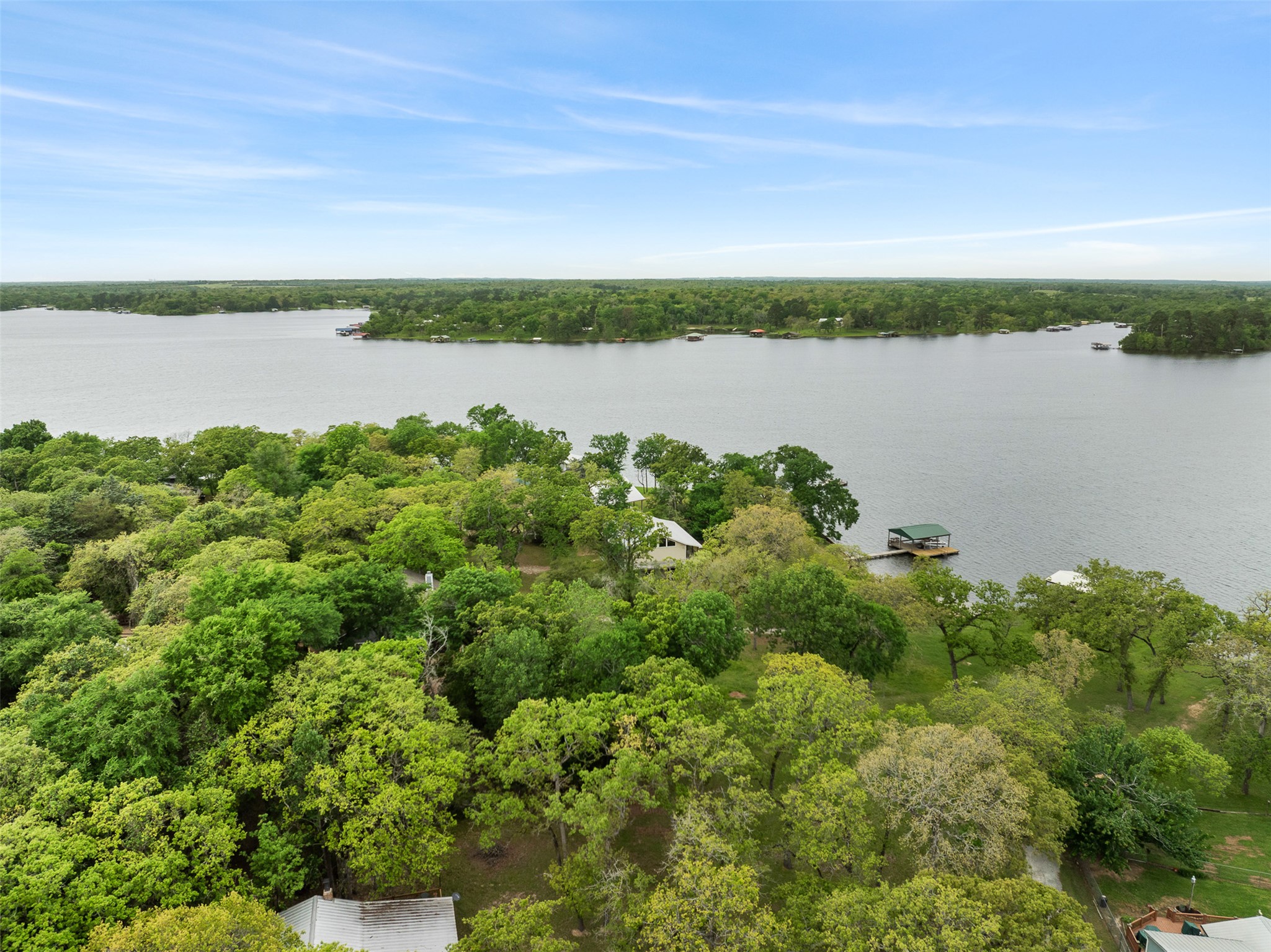 10959 Clyde Acord Road Franklin, TX 77856 - Photo 32 of 39 a view of a lake with houses in the back