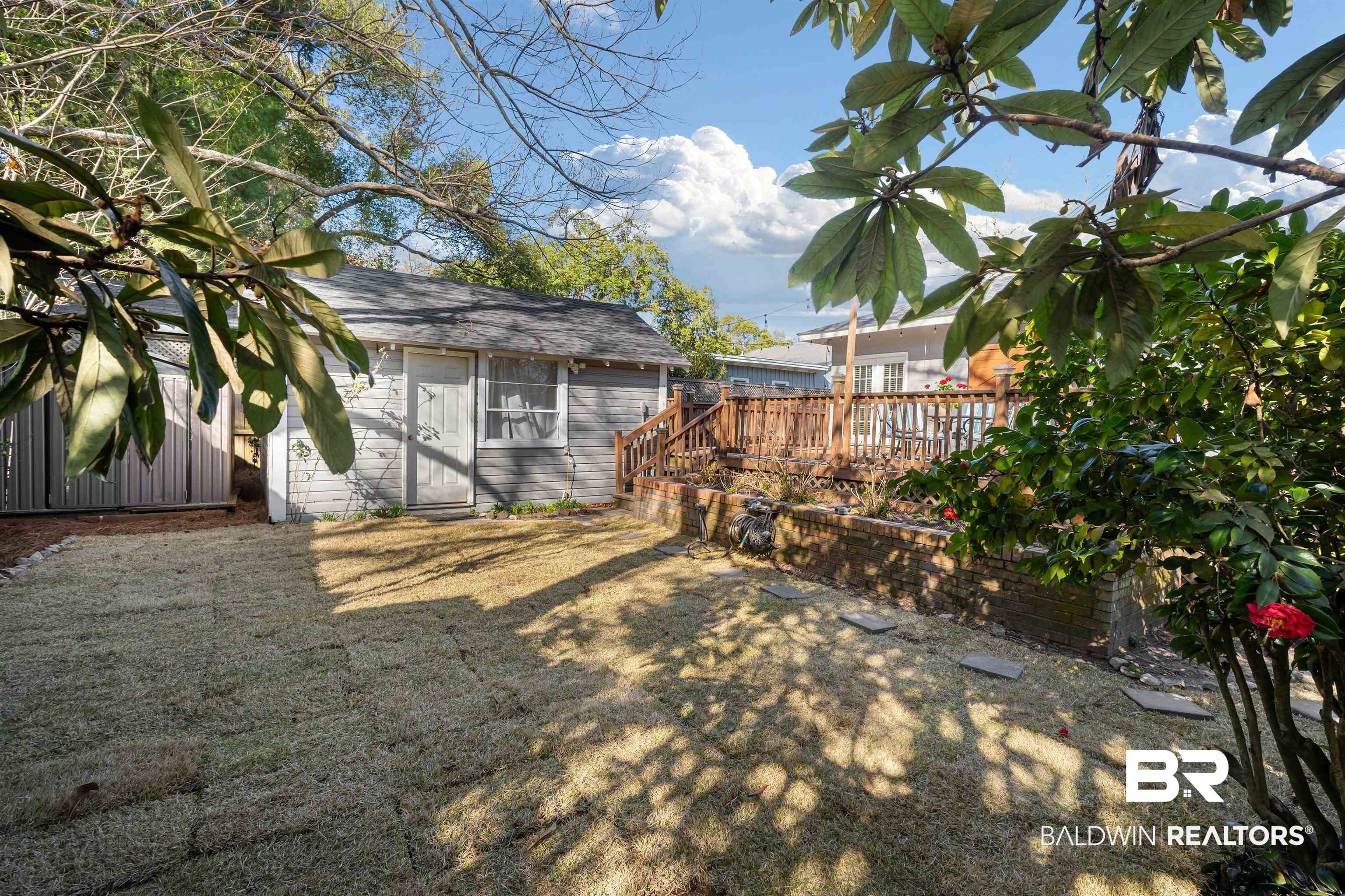 168 Mohawk Street Mobile, AL 36606 - Photo 31 of 31 View of grassy yard featuring an outbuilding and a deck
