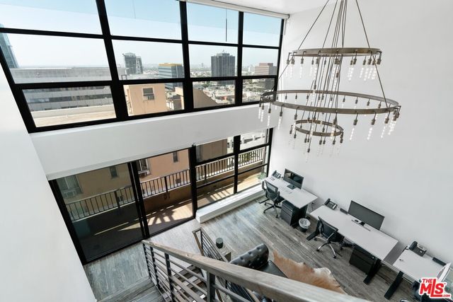a view of staircase with furniture and window