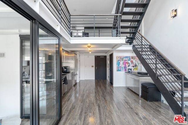 a view of entryway with wooden floor