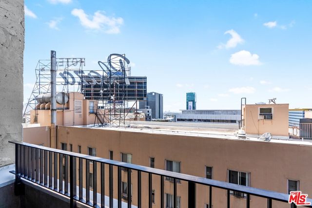 a view of a balcony with city view