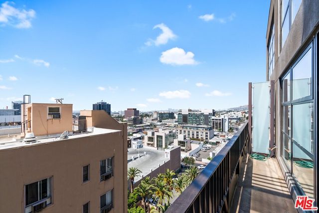 a view of a balcony with city view