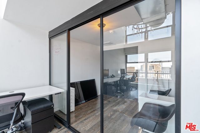 a view of a livingroom with furniture and a window