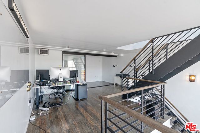 a room with furniture and wooden floor