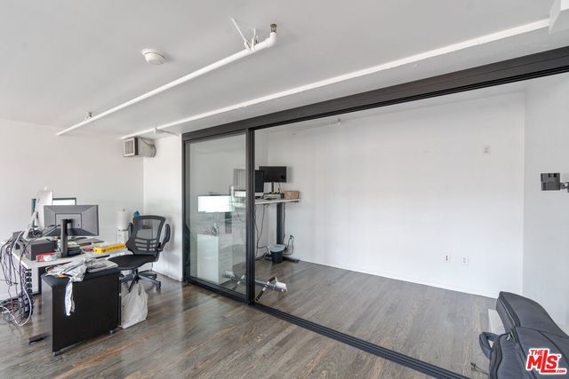 a view of entryway with wooden floor and stairs