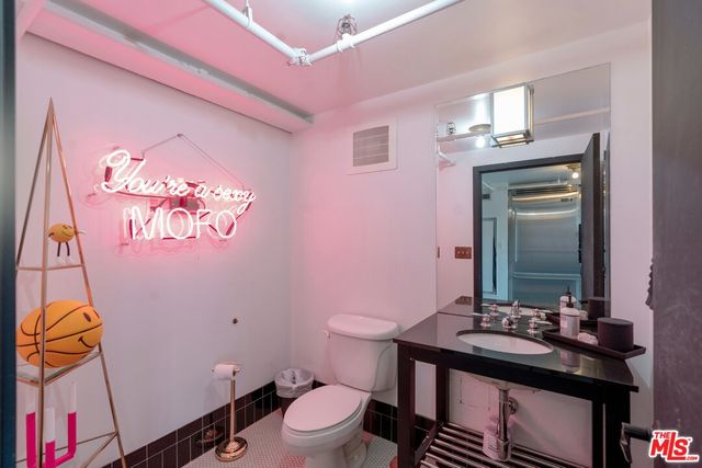 a view of swimming pool with outdoor seating and city view