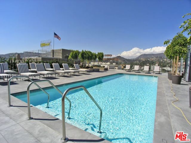 a view of a patio with a table and chairs
