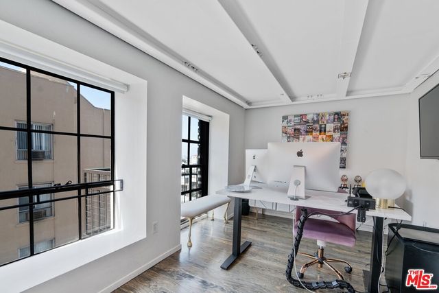 a workspace with furniture and window