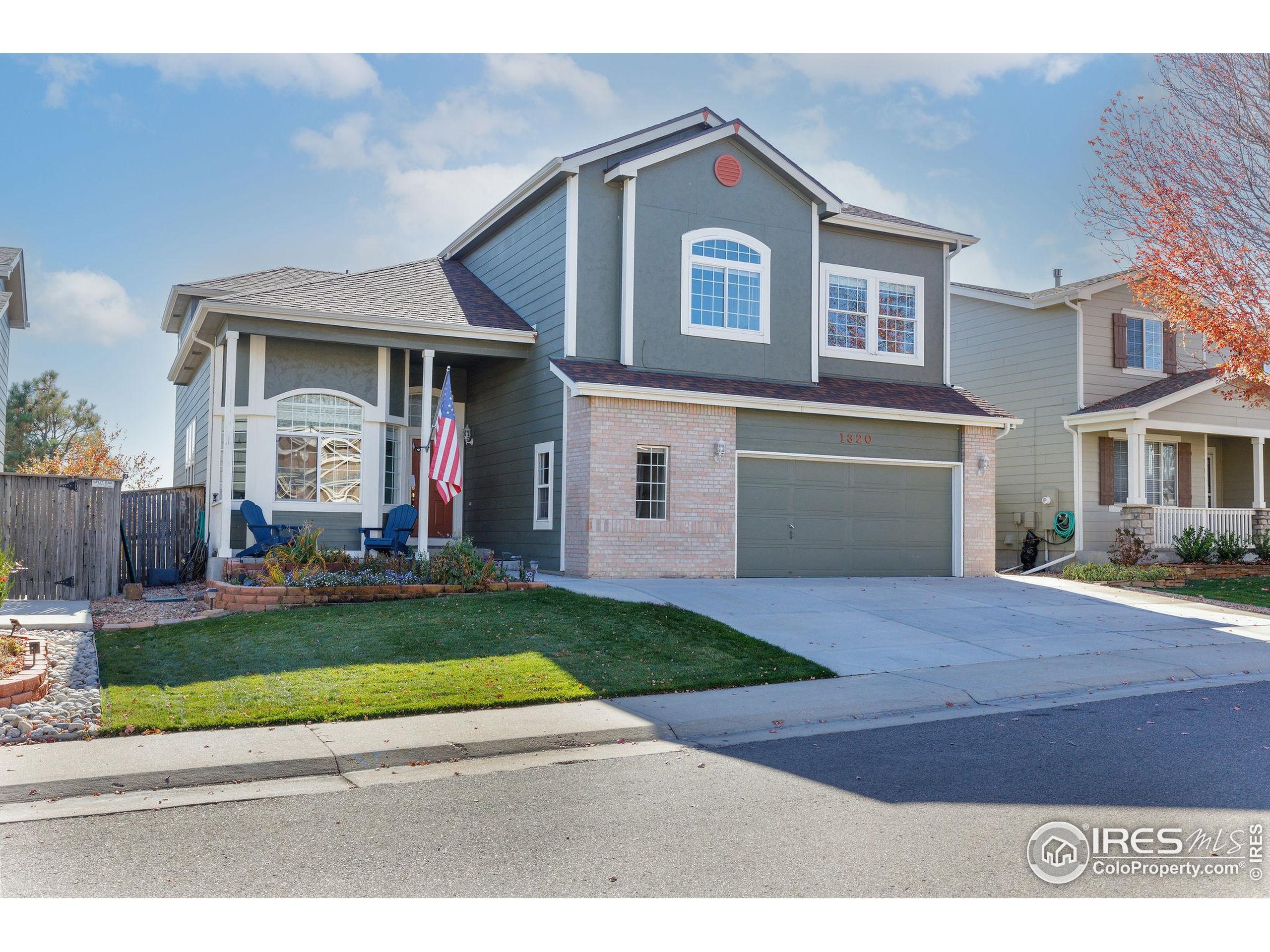 1320 West 12th Avenue Broomfield, CO 80020 - Photo 1 of 50 a front view of a house with a yard and garage