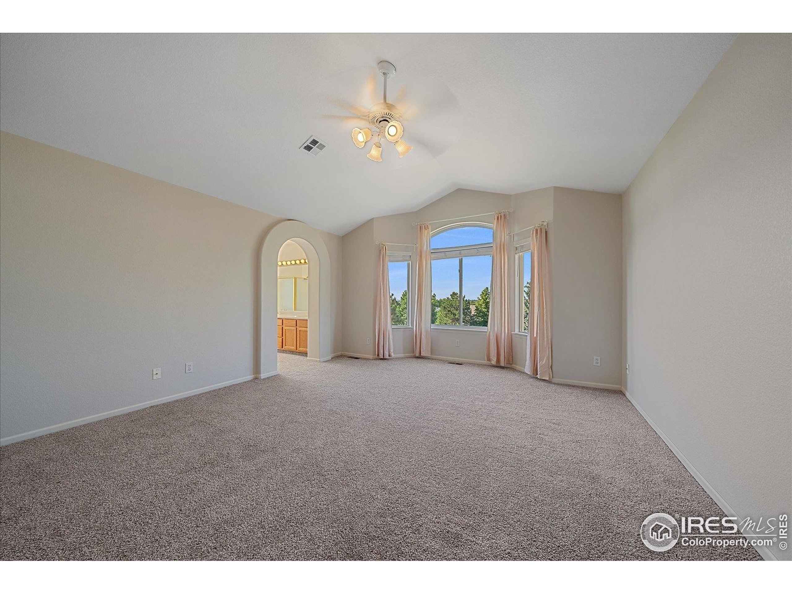 1320 West 12th Avenue Broomfield, CO 80020 - Photo 22 of 50 a view of a livingroom with a ceiling fan and window