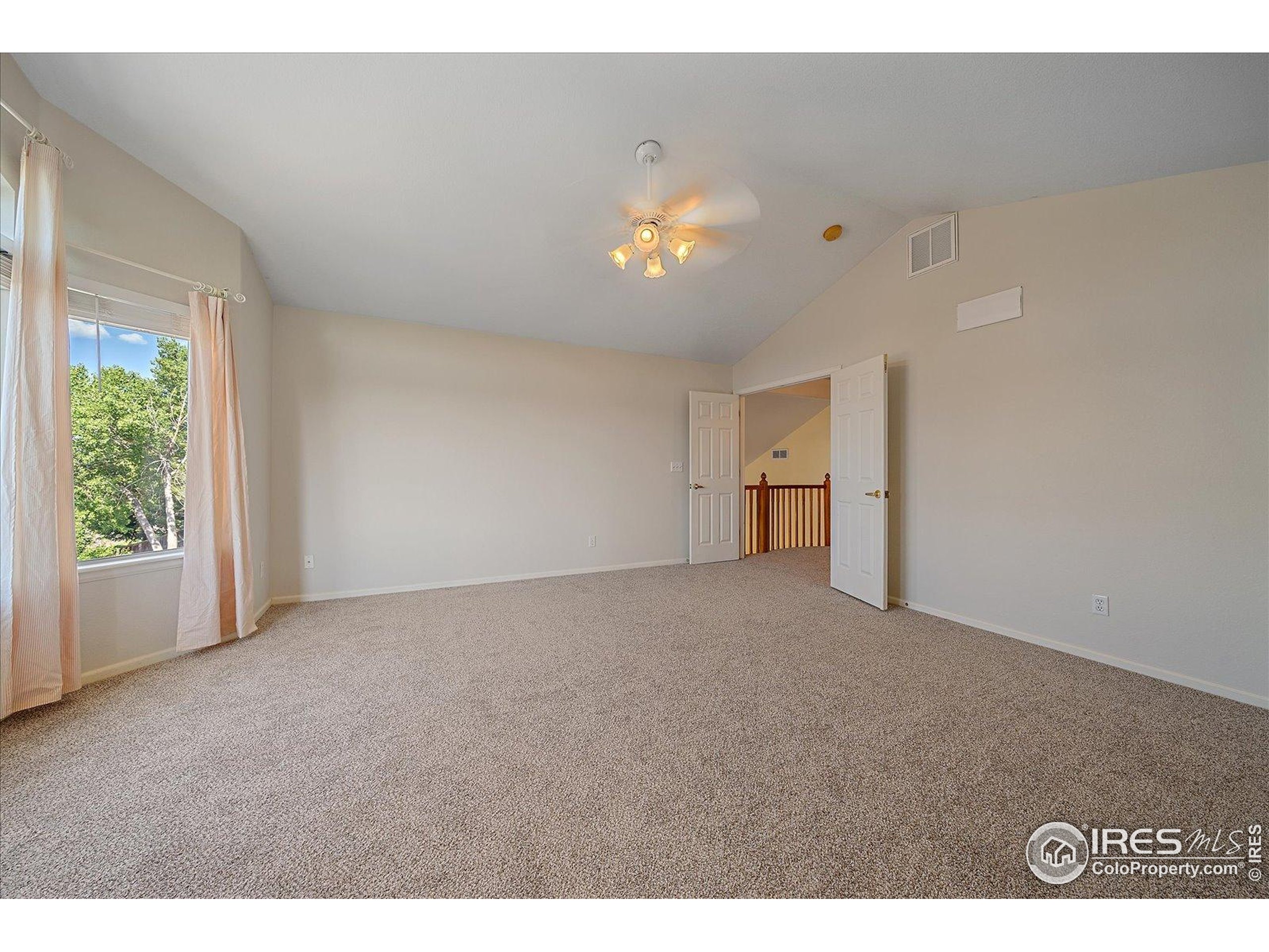 1320 West 12th Avenue Broomfield, CO 80020 - Photo 23 of 50 a view of an empty room with a window