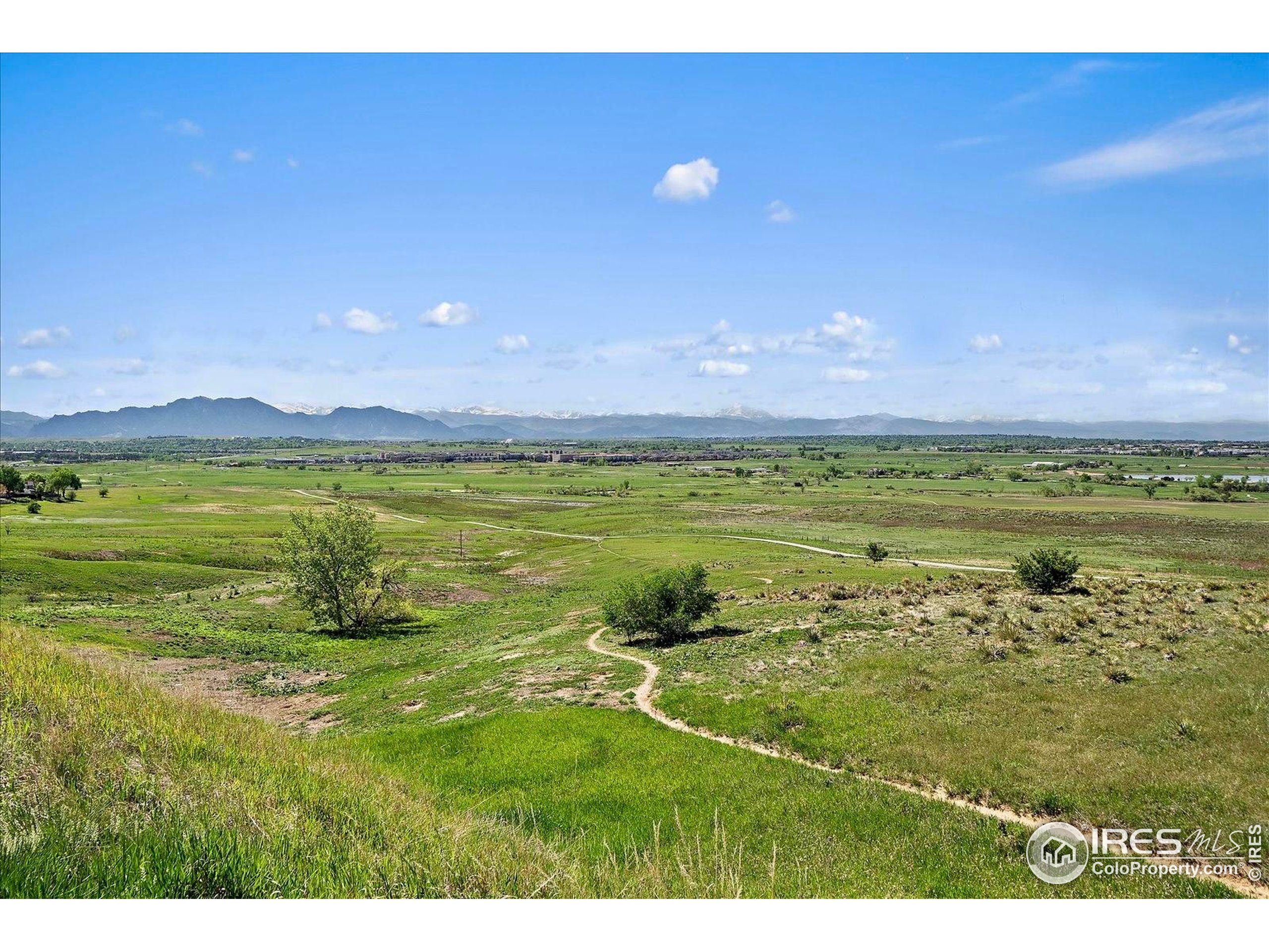 1320 West 12th Avenue Broomfield, CO 80020 - Photo 44 of 50 a view of a lake with a big yard