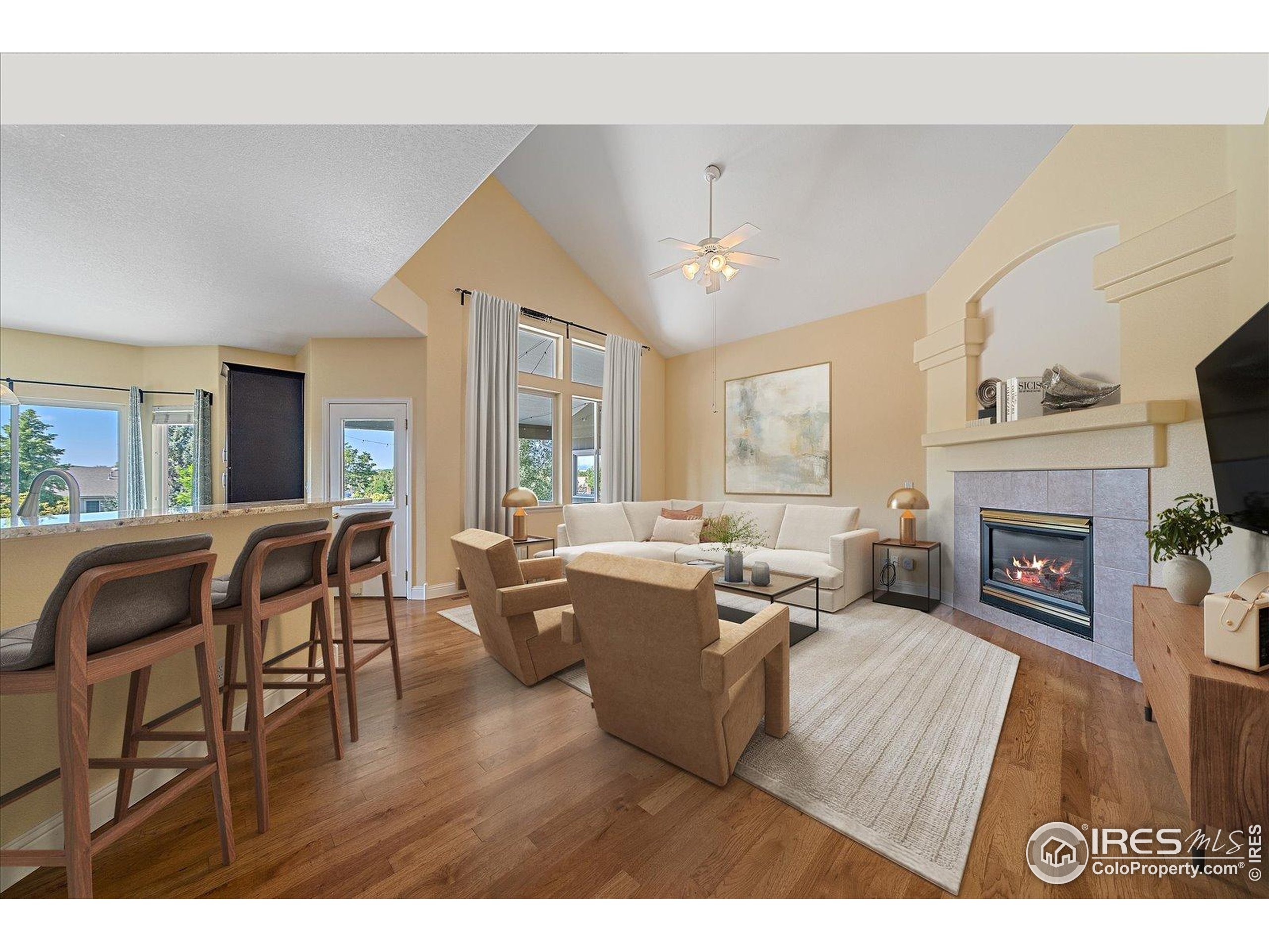 1320 West 12th Avenue Broomfield, CO 80020 - Photo 10 of 50 a living room with furniture and a fireplace