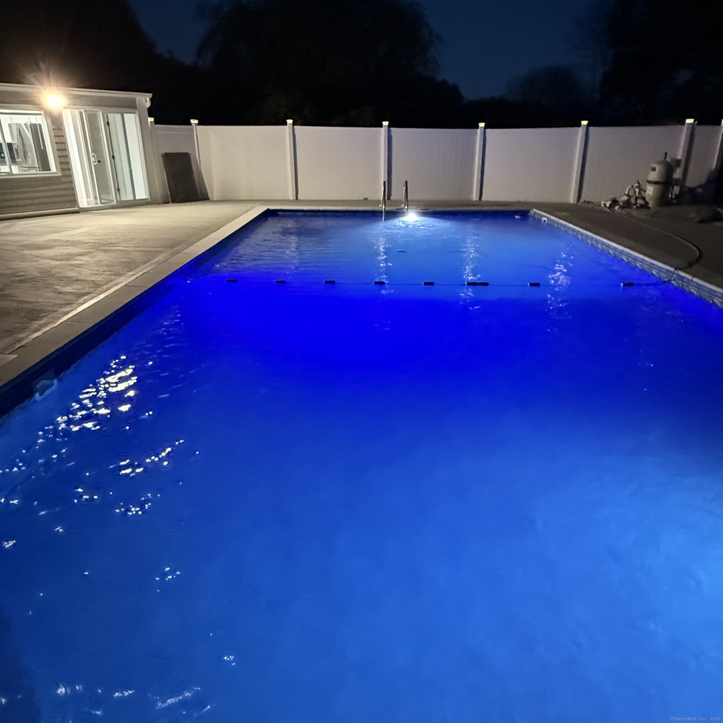 a living room with furniture and a pool