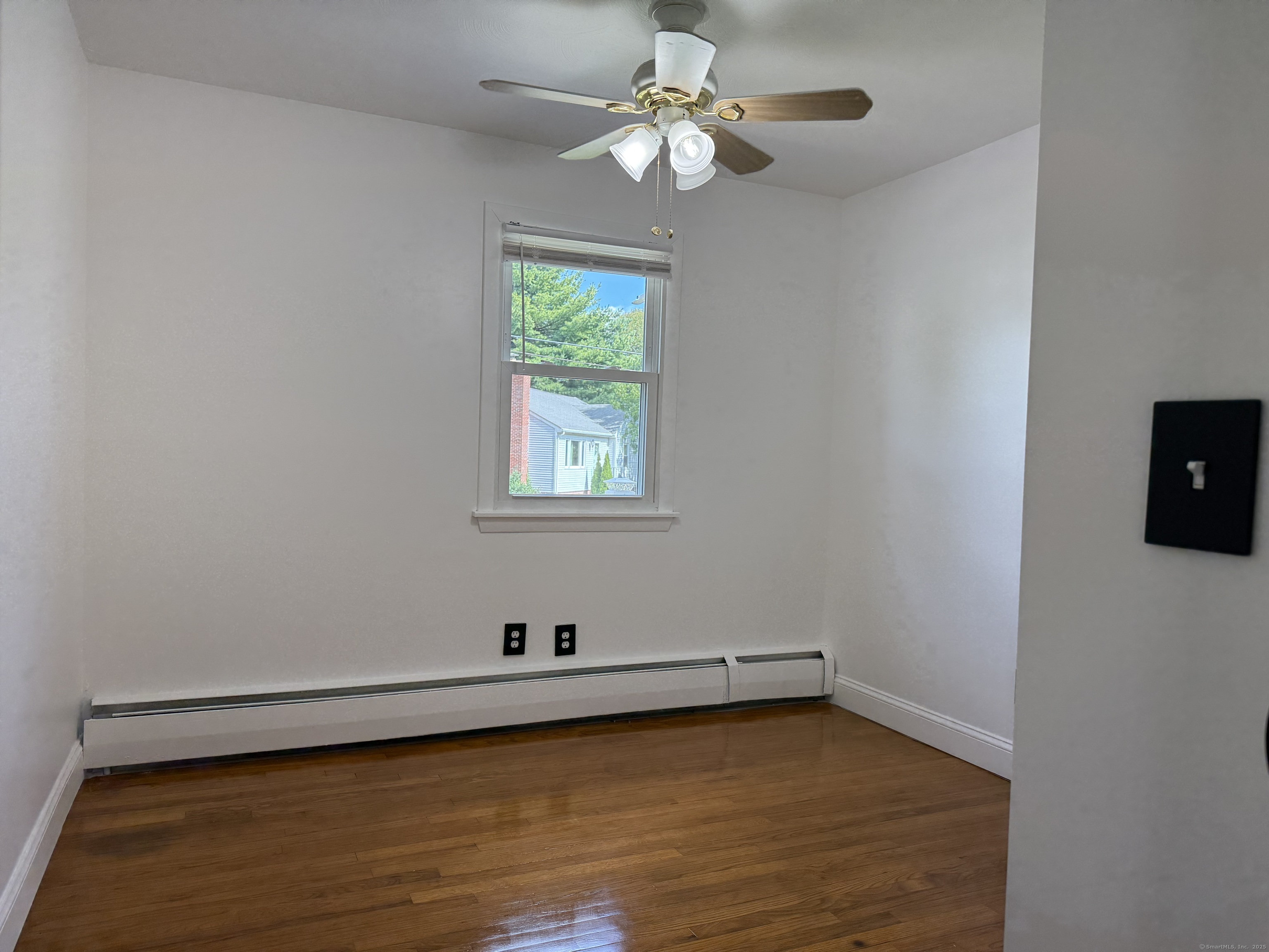 29 Blueberry Hill Road Groton, CT 06340 - Photo 11 of 29 wooden floor in an empty room with a window