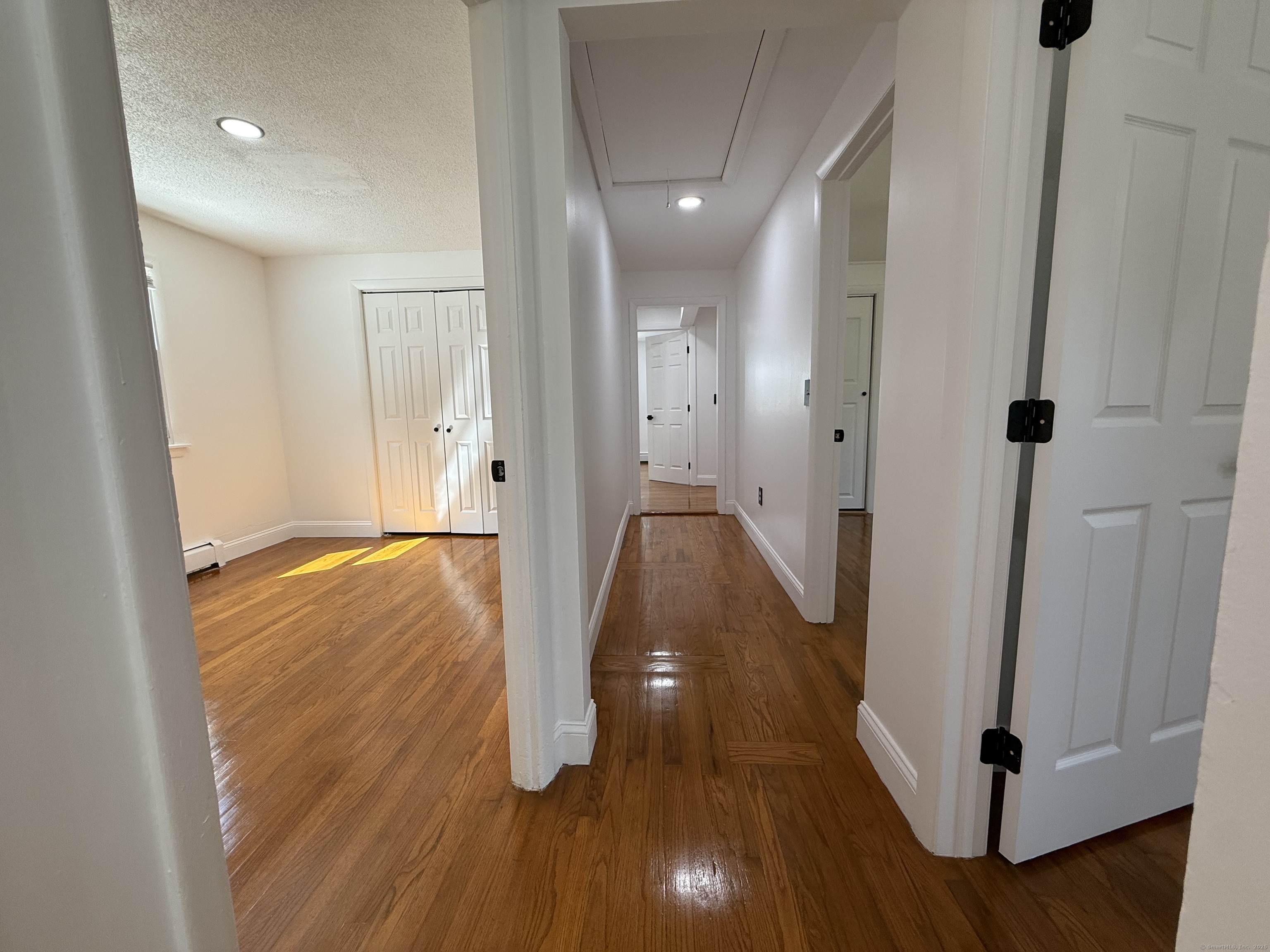 29 Blueberry Hill Road Groton, CT 06340 - Photo 17 of 29 a view of a hallway with wooden floor