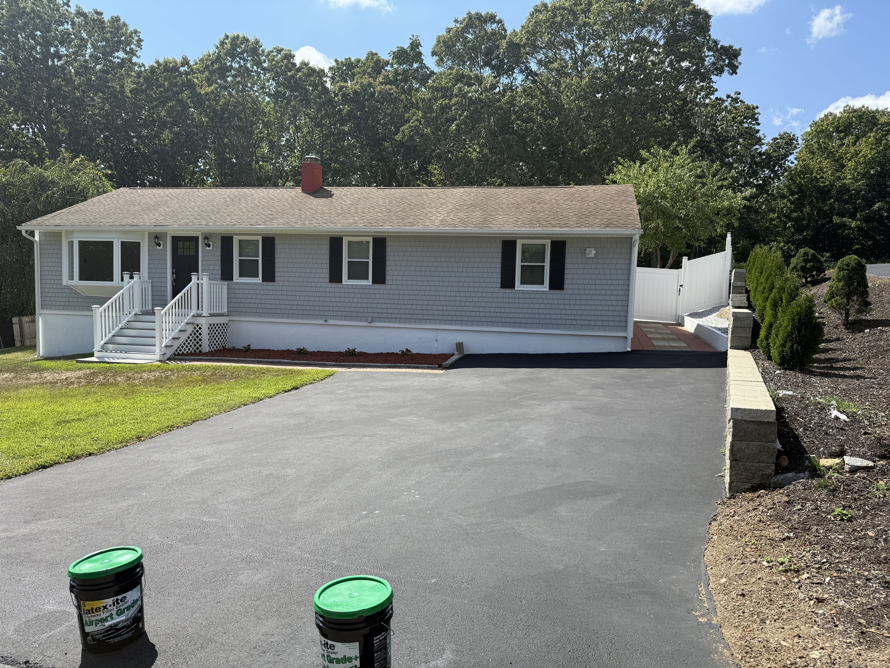 29 Blueberry Hill Road Groton, CT 06340 - Photo 7 of 29 a front view of a house with a yard