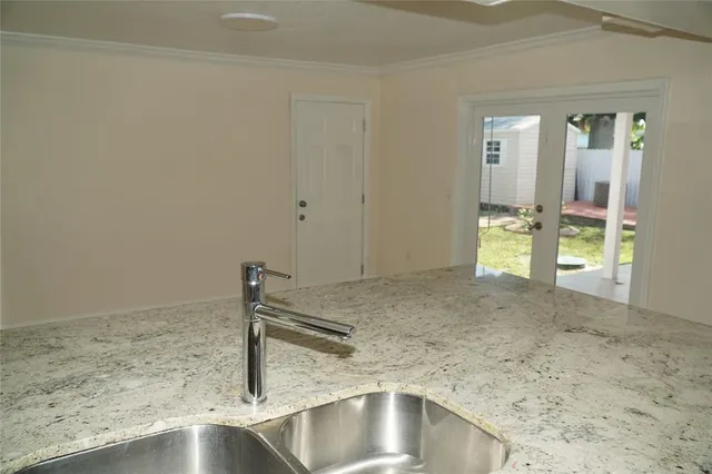a kitchen with a sink and cabinets