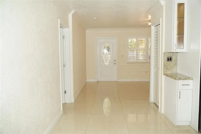 a view of a bathroom with sink and shower