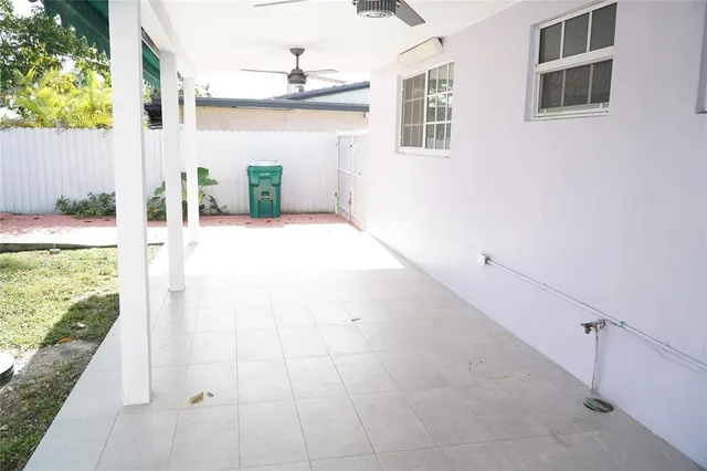 a view of a backyard of the house