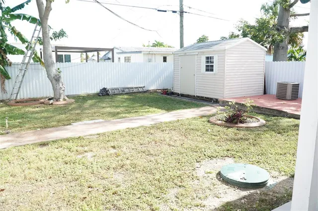 a view of a backyard of the house