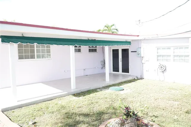 a front view of a house with a outdoor space