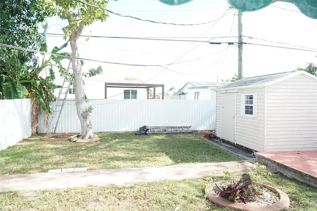 a view of a backyard of the house