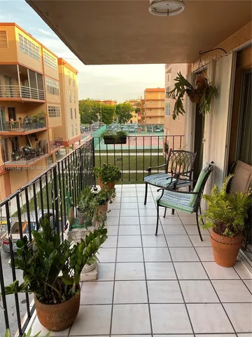 a view of a terrace with furniture