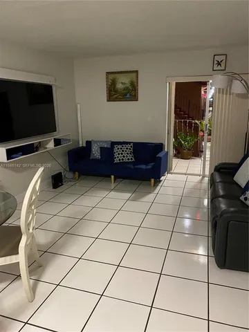 a living room with a couch and a flat screen tv