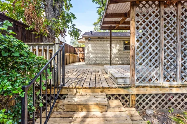 a view of balcony with wooden floor