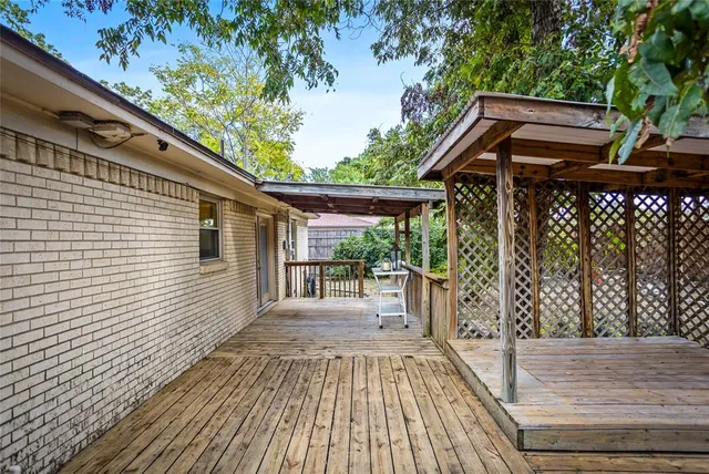 a view of a patio with wooden floor