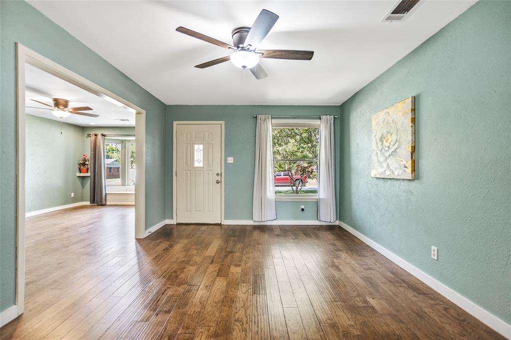 435 Hanbee Street Richardson, TX 75080 - Photo 6 of 36 Entry view into the living room area featuring a ceiling fan, and beautiful engineered wood flooring