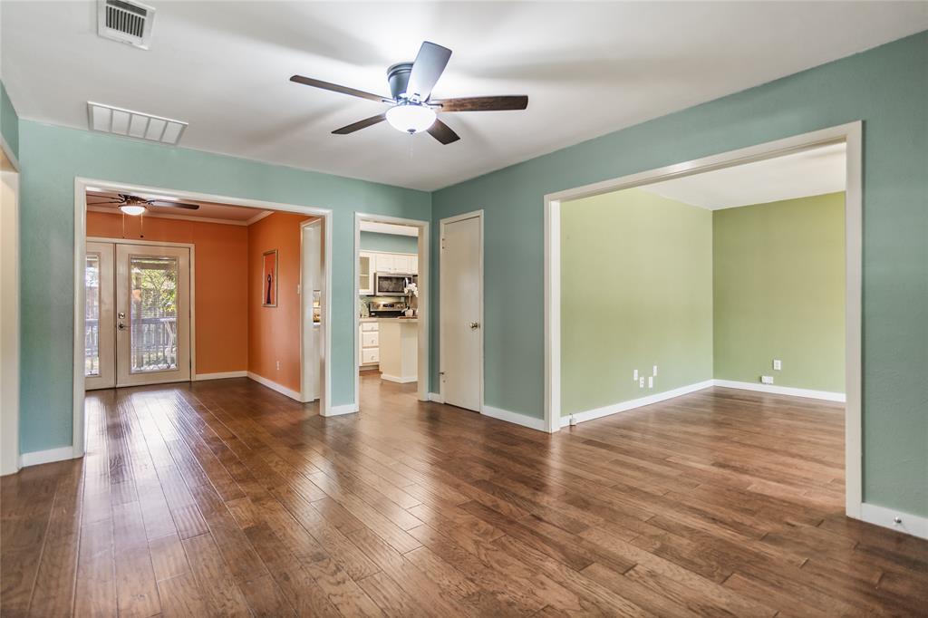 435 Hanbee Street Richardson, TX 75080 - Photo 10 of 36 A view from living room looking toward dining room and kitchen ahead and family room to the right.
