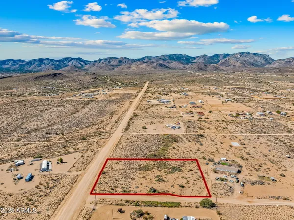a view of an ocean beach and mountain