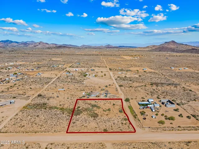 a view of an ocean beach and mountain