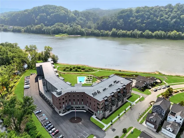 an aerial view of a house with a lake view