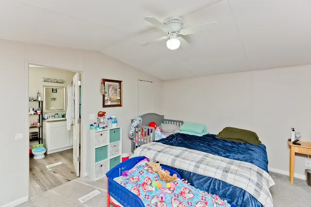 a bedroom with a bed and dresser