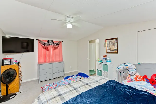 a bedroom with furniture and a bed