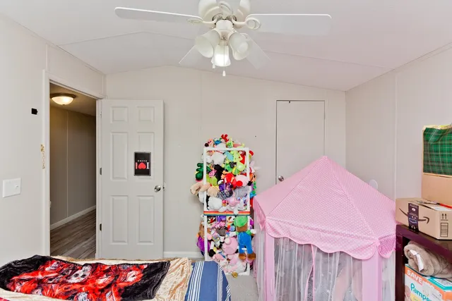 a view of a chair and tables in the balcony