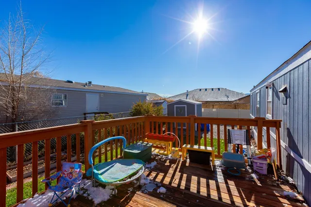 a view of a backyard with a table and chairs