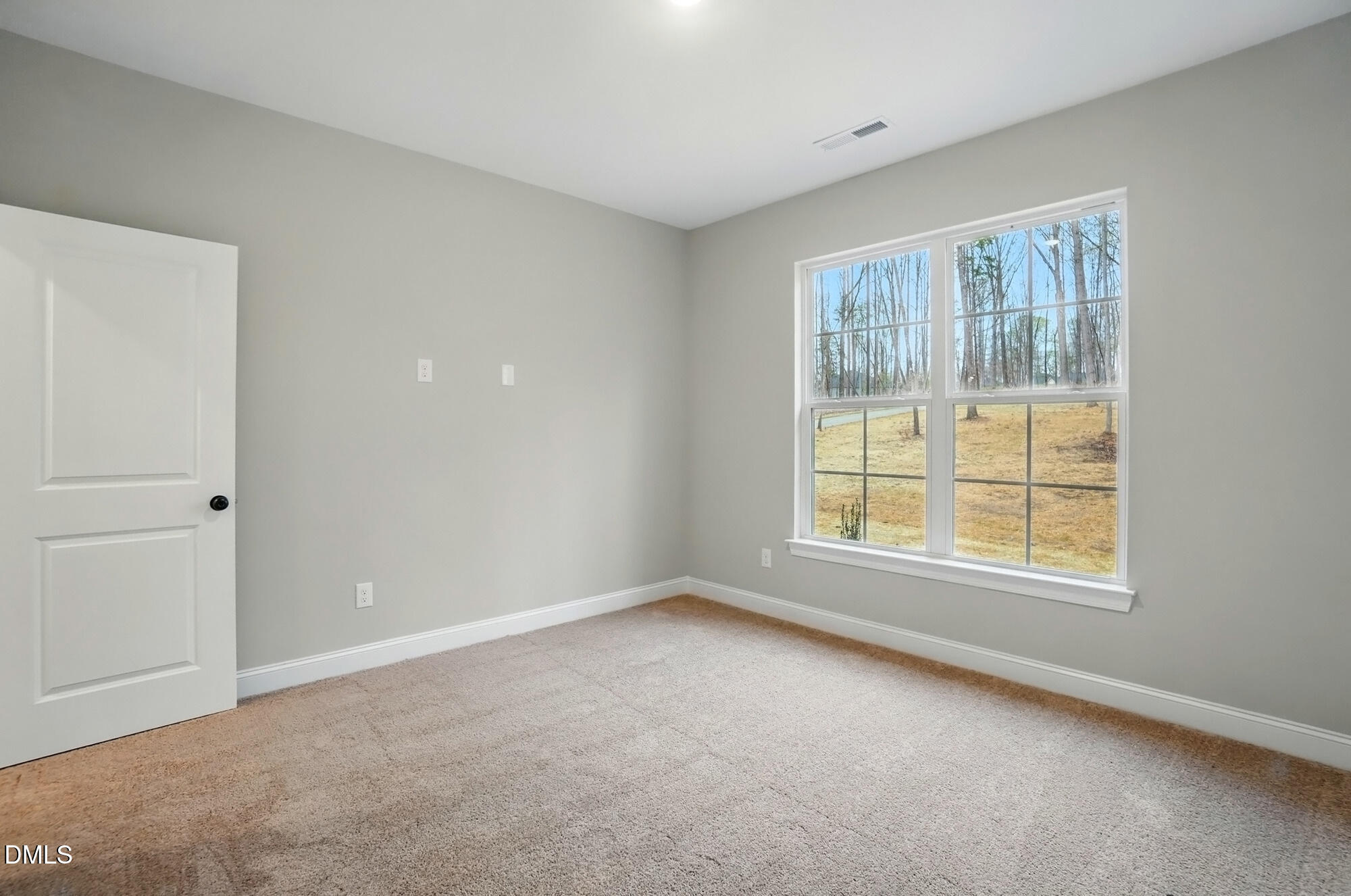 285 Gilliland Road Siler City, NC 27344 - Photo 23 of 45 a view of an empty room with a window