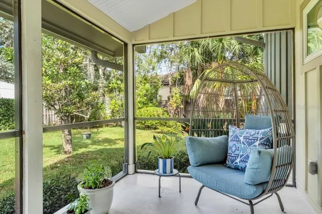 a living room with a large window and a table