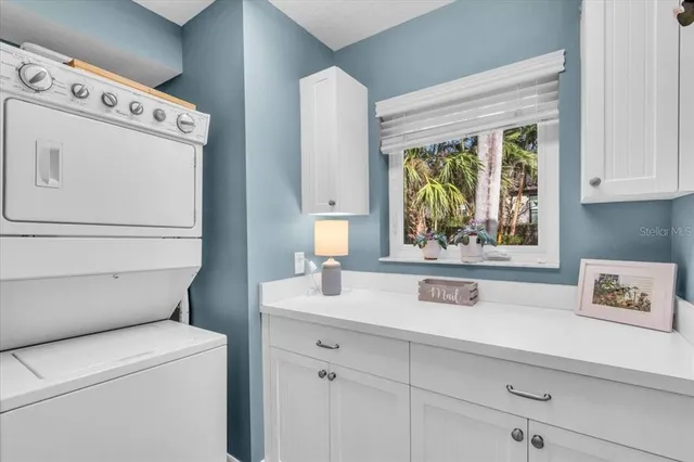 a view of washer and dryer with kitchen countertop