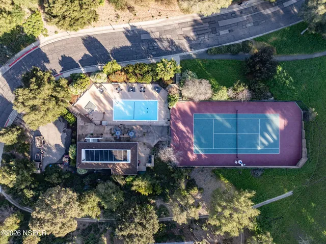 a aerial view of a house with a yard