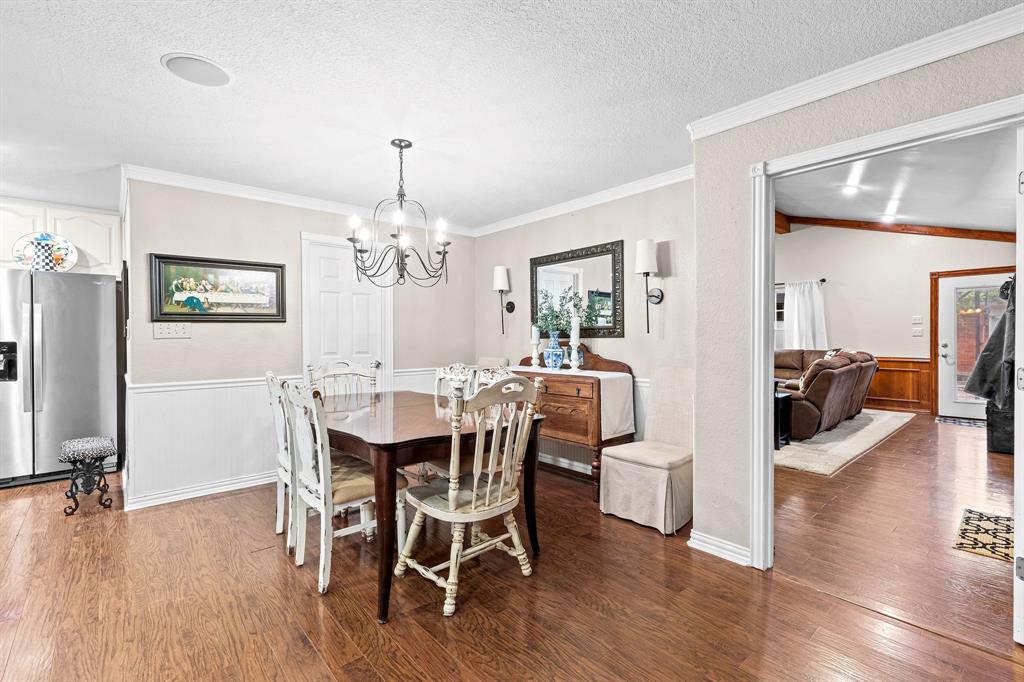 934 North Maple Street Muenster, TX 76252 - Photo 7 of 39 a view of a dining room with furniture window and wooden floor