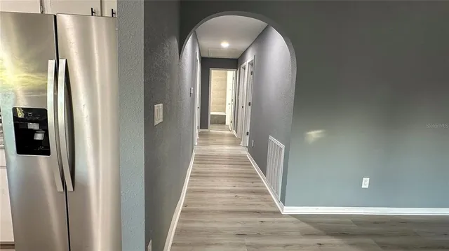 a view of a hallway view with staircase