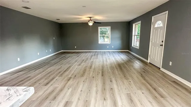 a view of a balcony with wooden floor