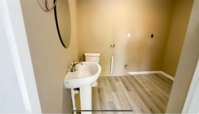 a bathroom with a sink and mirror