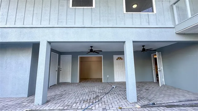 a view of a hallway with wooden cabinet
