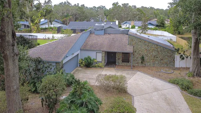 an aerial view of house with yard swimming pool and outdoor seating